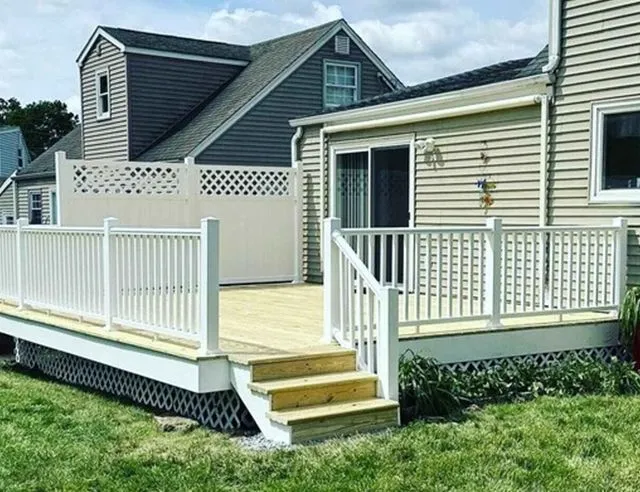 New deck construction with white railings by CorContracting in South Brunswick, NJ