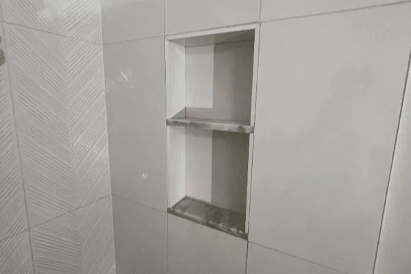 Built-in shower niche with shelves installed in East Brunswick, NJ bathroom