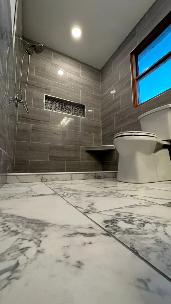 Bathroom shower remodel with textured tile by CorContracting in Spotswood, NJ