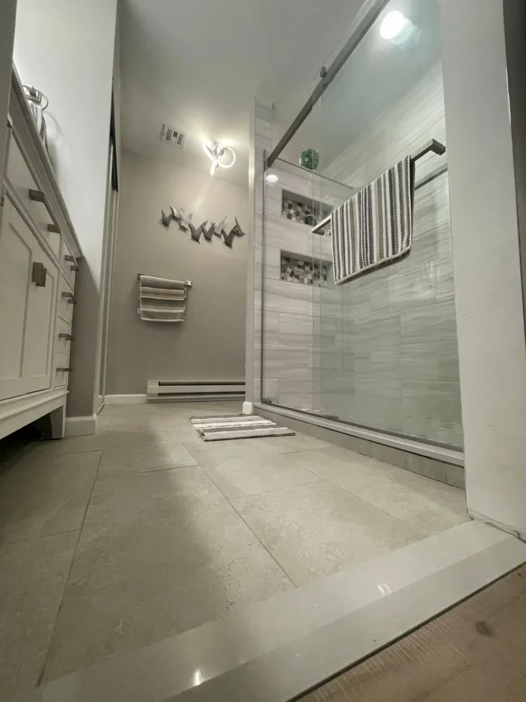 Modern bathroom renovation with glass shower by CorContracting in Monroe Township, NJ