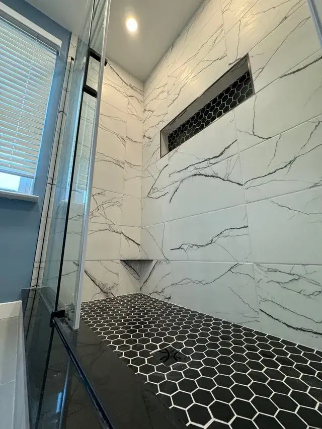Modern walk-in shower design with marble and hexagon tile in Central NJ, NJ
