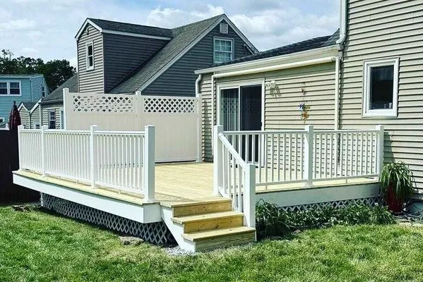New deck construction with white railings by CorContracting in Old Bridge, NJ