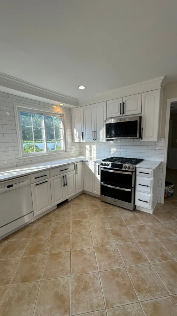 White kitchen remodel with subway tile backsplash in Highland Park, NJ